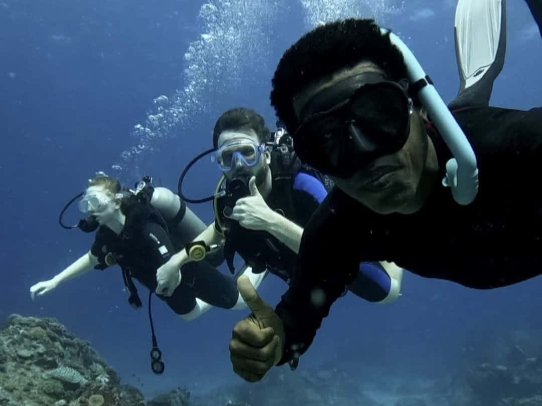 Divers over coral reef